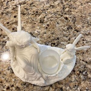 Beautiful Mother Angel and Daughter Angel looking at a votive candle.